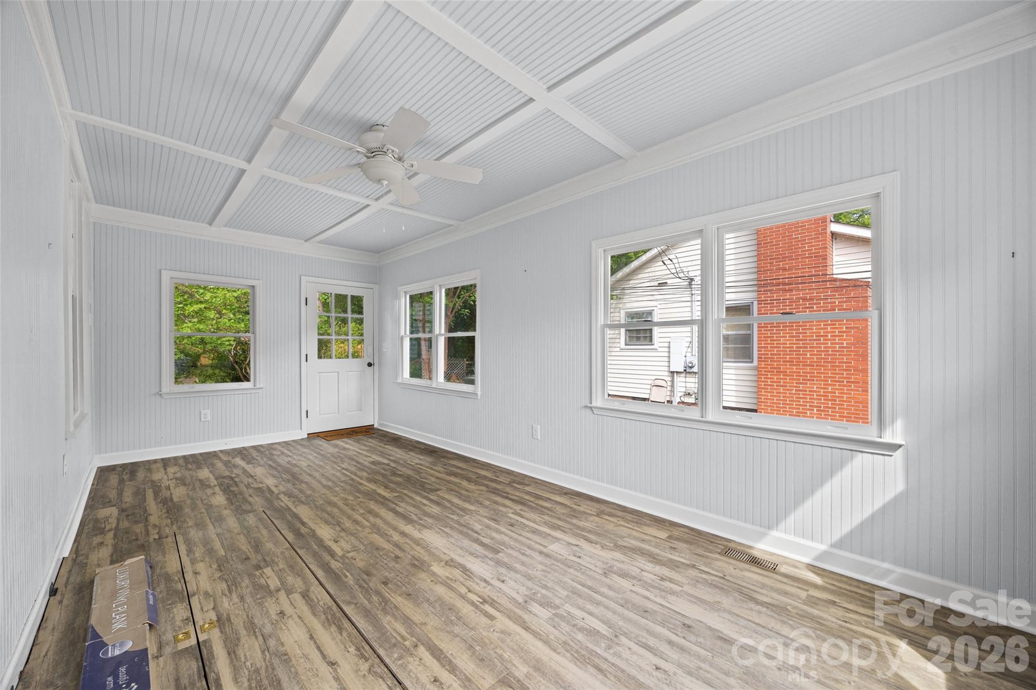 202 Pressley Street Clover, SC 29710 - Photo 21 of 26 a view of an empty room with a window and wooden floor