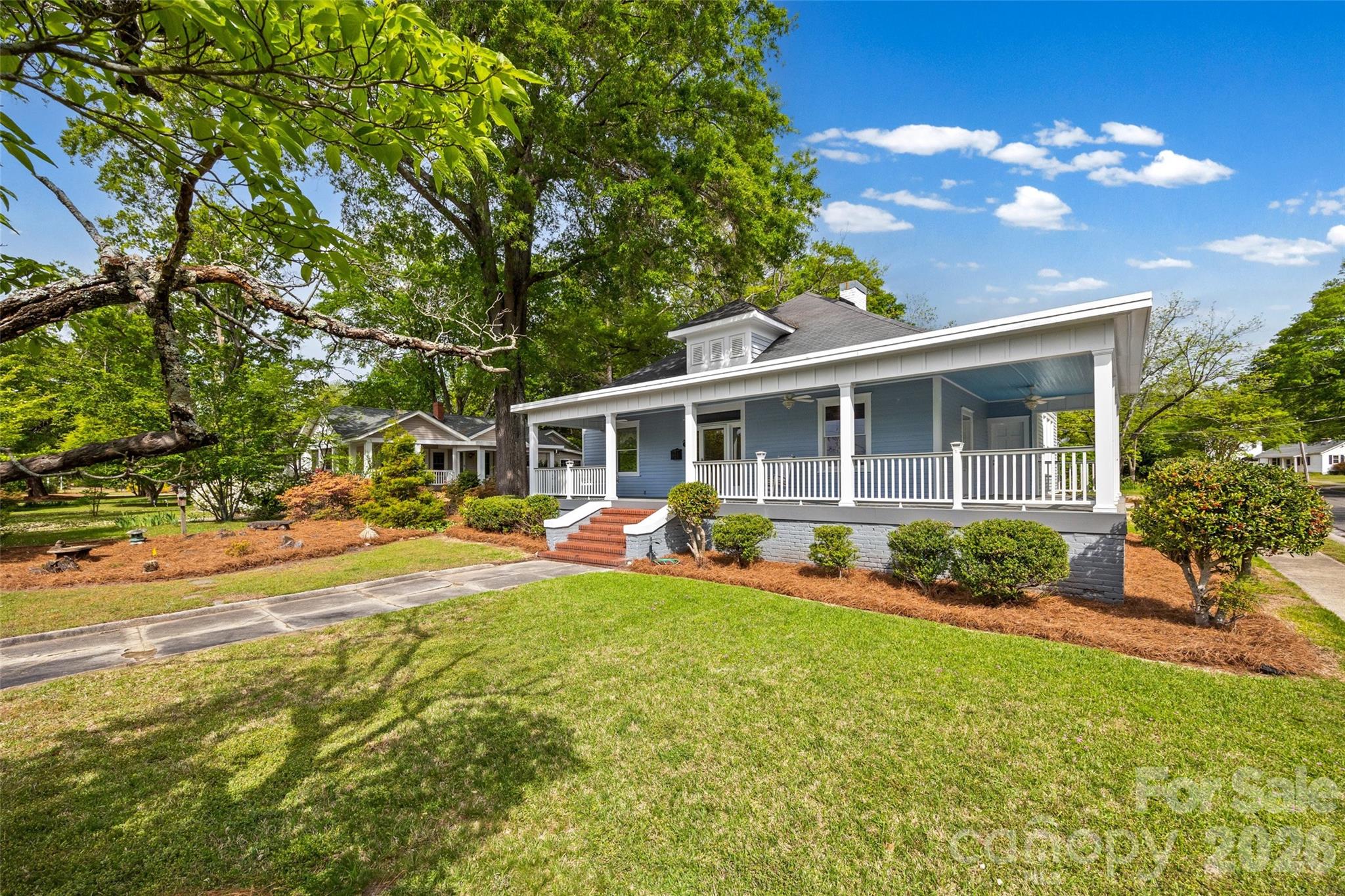 202 Pressley Street Clover, SC 29710 - Photo 26 of 26 a view of a house with a yard and sitting area