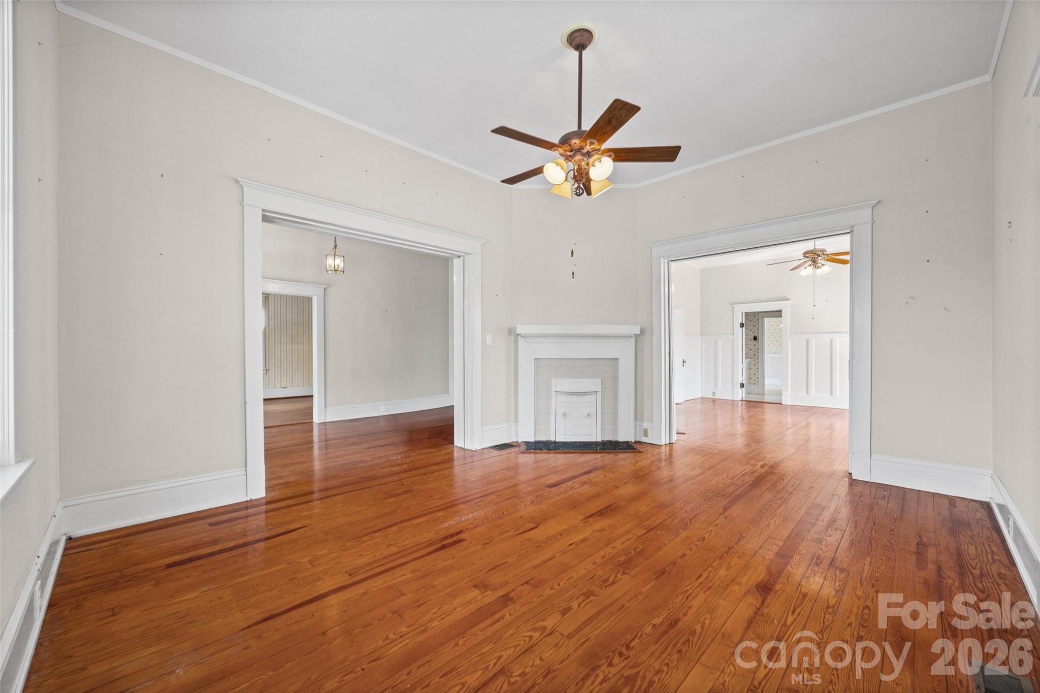 202 Pressley Street Clover, SC 29710 - Photo 5 of 26 a view of empty room with wooden floor and ceiling fan