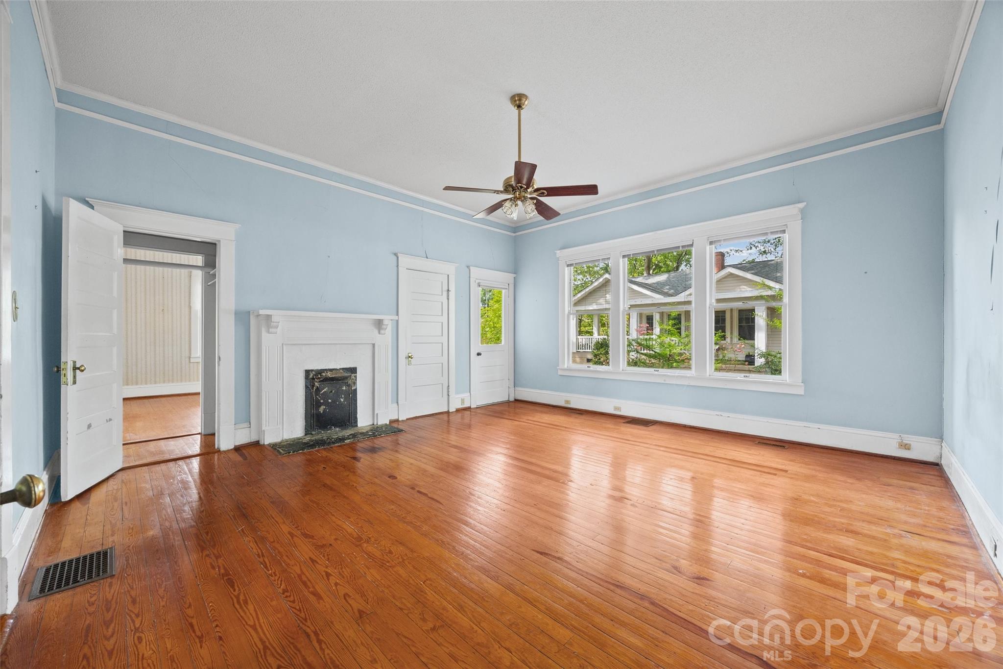 202 Pressley Street Clover, SC 29710 - Photo 9 of 26 a view of an empty room with window and wooden floor