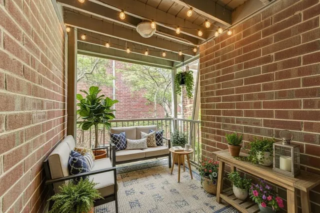 a reading room with furniture and a potted plant