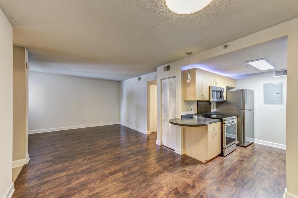 381 Ralph McGill Boulevard Northeast, Unit E Atlanta, GA 30312 - Photo 2 of 27 a kitchen with stainless steel appliances a stove and a refrigerator