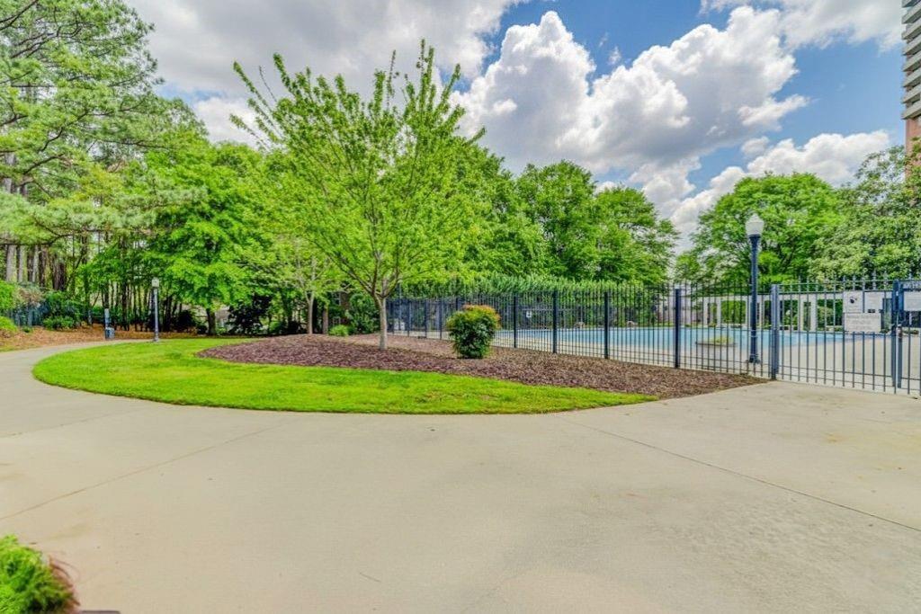 381 Ralph McGill Boulevard Northeast, Unit E Atlanta, GA 30312 - Photo 24 of 27 a view of a house with a big yard and potted plants