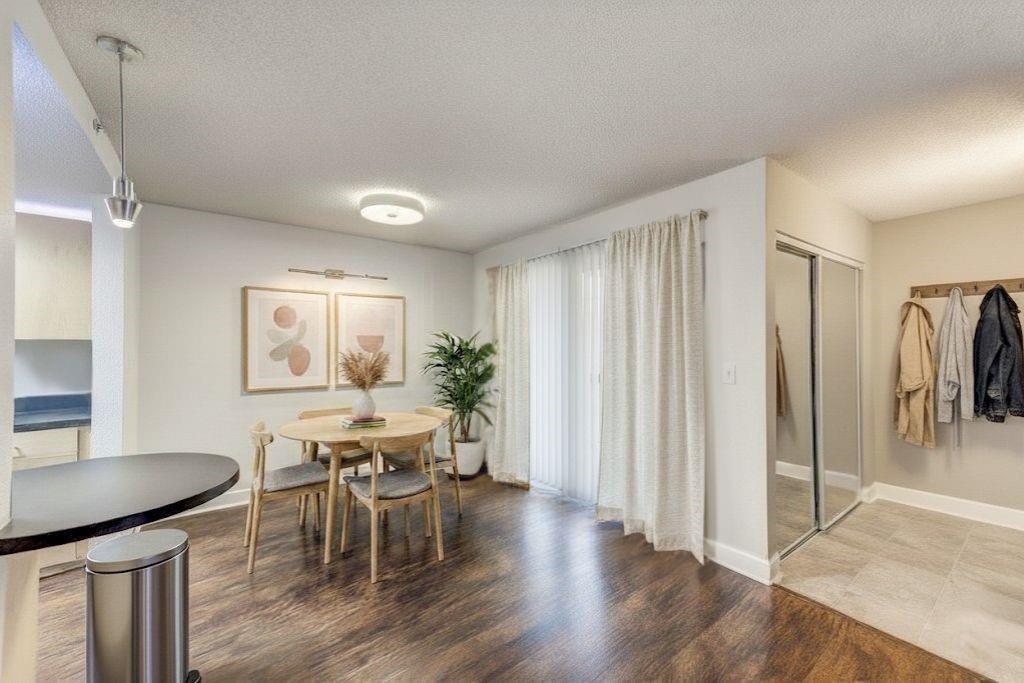 381 Ralph McGill Boulevard Northeast, Unit E Atlanta, GA 30312 - Photo 5 of 27 a view of a dining room with furniture and wooden floor