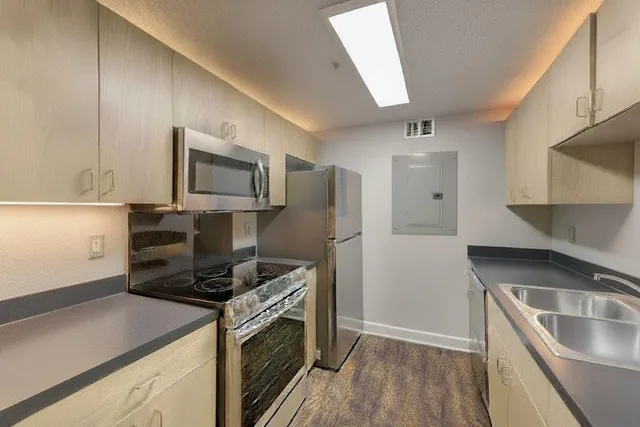 a kitchen with a refrigerator stove and microwave