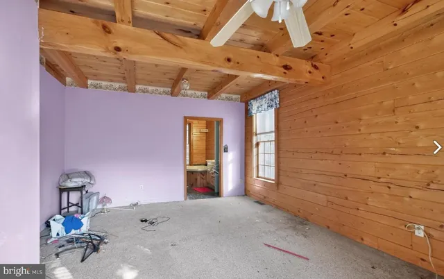 a view of a room with a wooden table