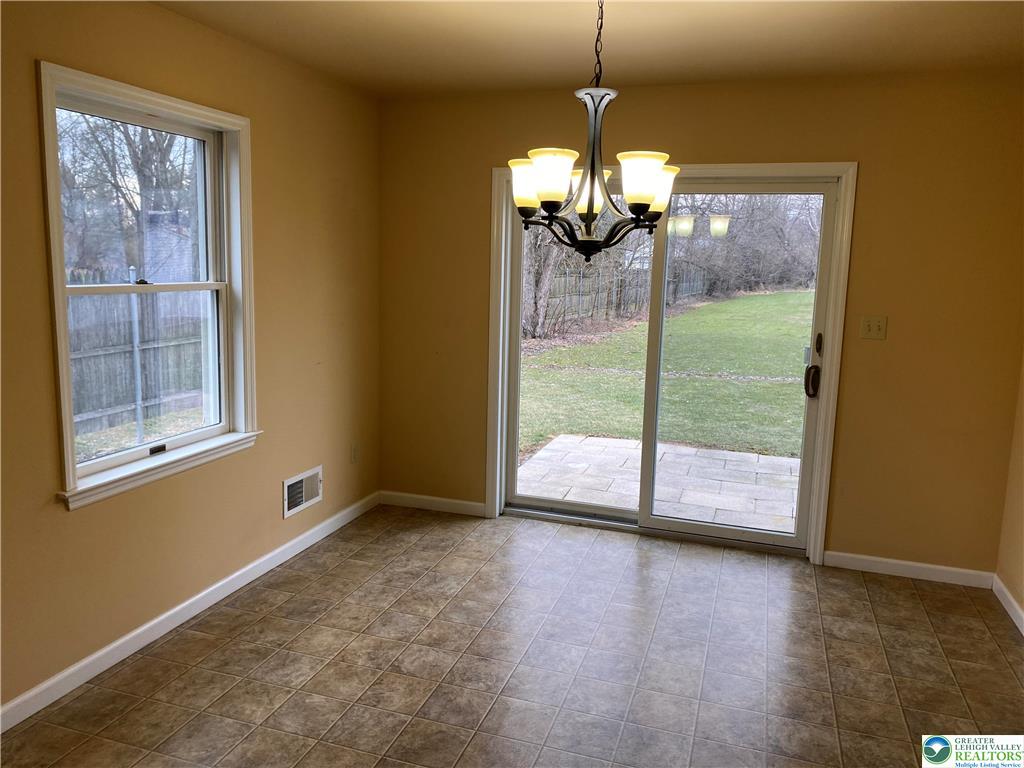 2862 Christian Springs Road Nazareth, PA 18064 - Photo 5 of 16 A well-lit dining area offers direct patio access to a private backyard.