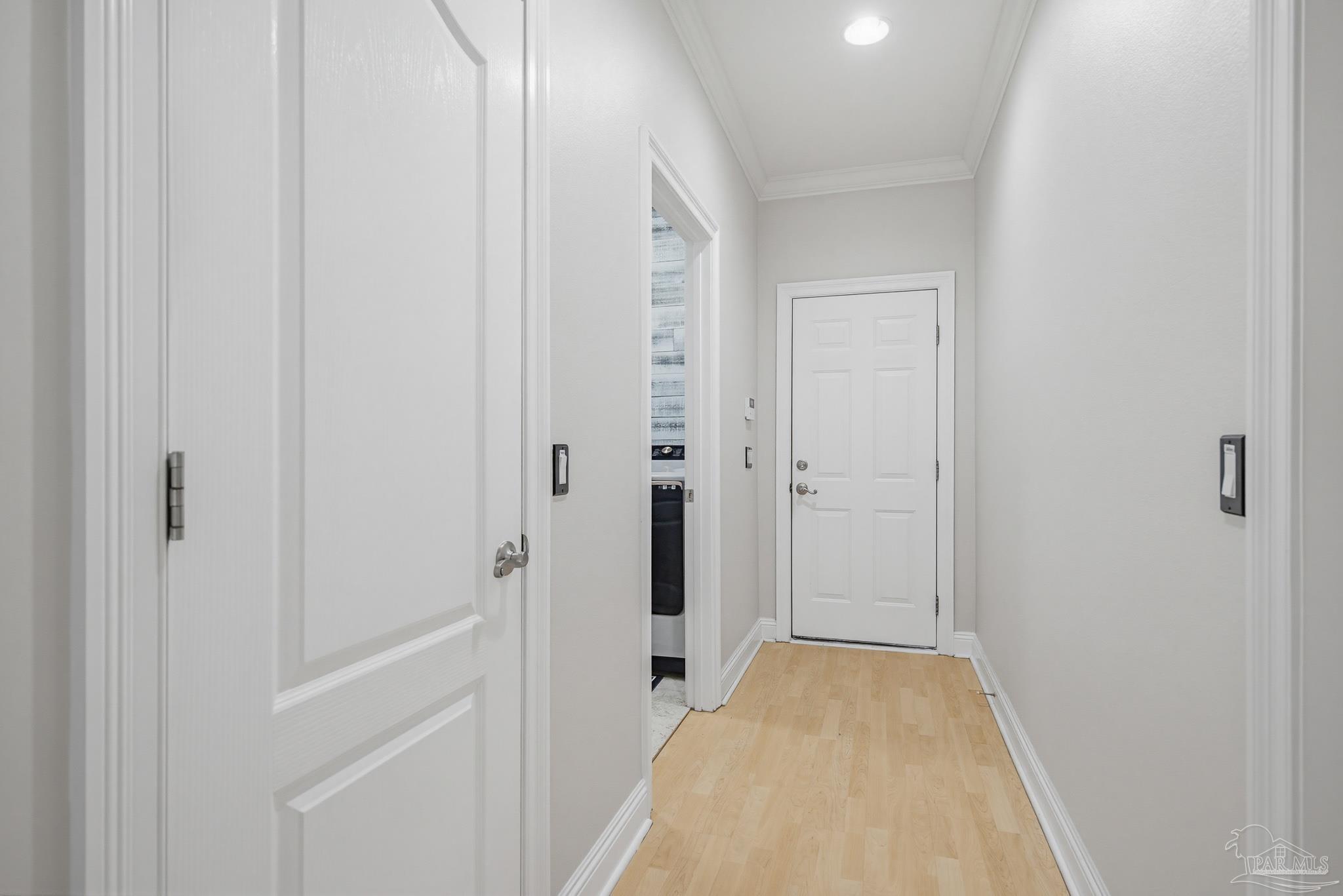 2855 Walling Road Milton, FL 32570 - Photo 35 of 55 a view of a hallway with closet and wooden floor