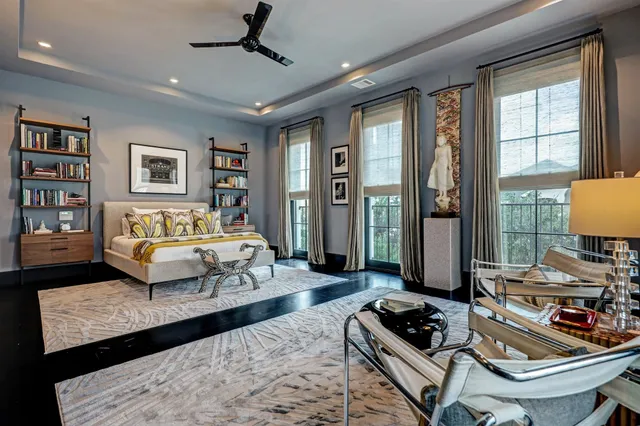 a bedroom with a bed a couch and a window