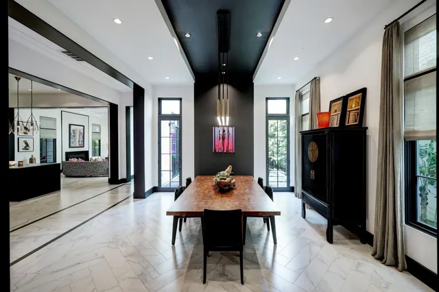 a dining room with wooden floor and a table