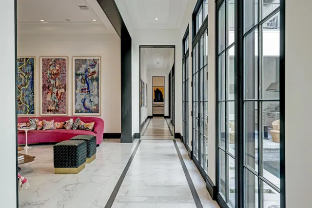 a bedroom with furniture and a balcony