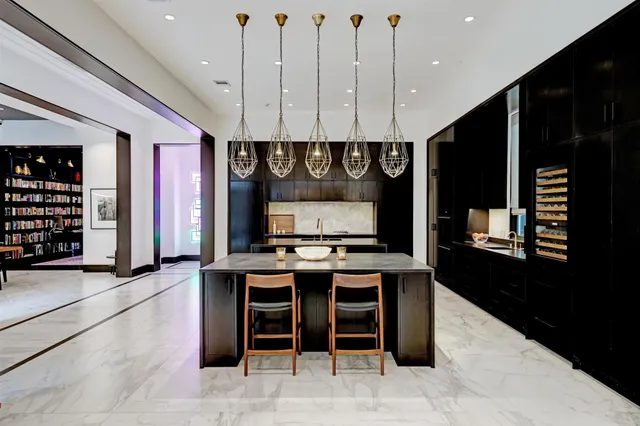 a kitchen with stainless steel appliances granite countertop a stove a refrigerator and a microwave