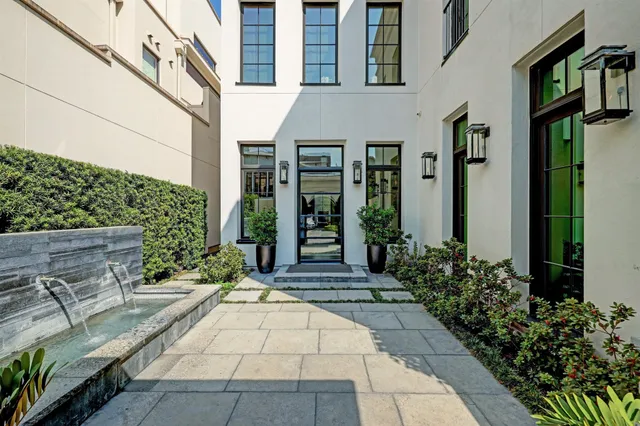 a view of a building with potted plants