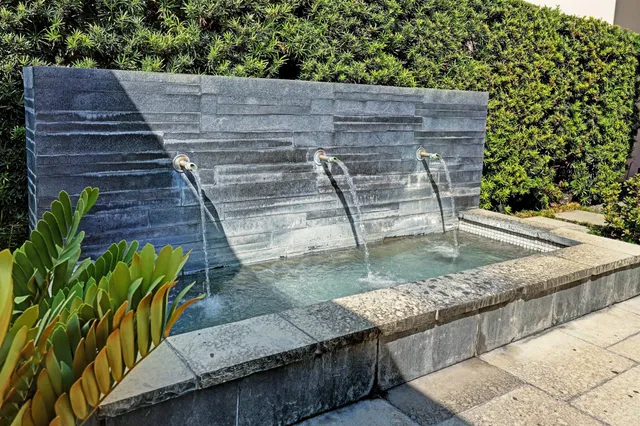 a view of a backyard with sitting area