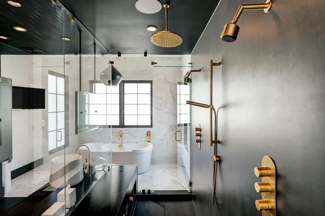 a bathroom with a tub and a sink