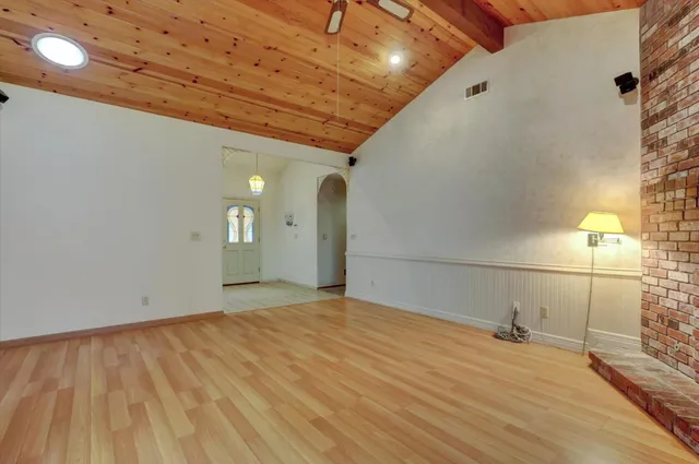 a view of a livingroom with wooden floor
