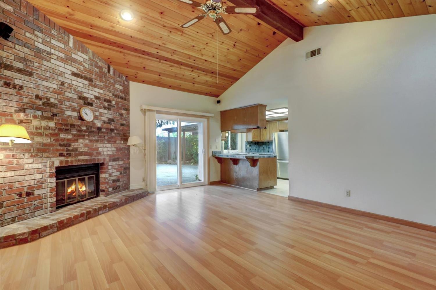 5316 Engle Road Carmichael, CA 95608 - Photo 17 of 47 a view of empty room with wooden floor and fireplace