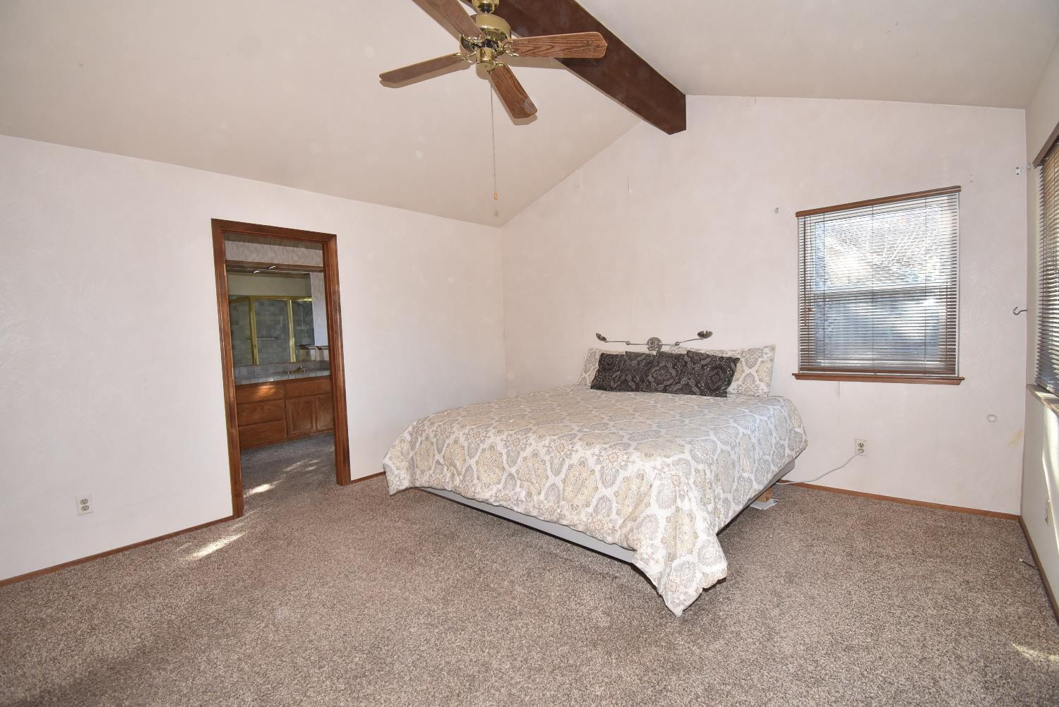 5316 Engle Road Carmichael, CA 95608 - Photo 26 of 47 a bedroom with a bed and a painting on the wall