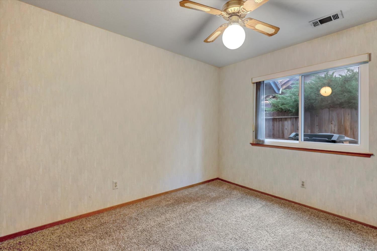 5316 Engle Road Carmichael, CA 95608 - Photo 32 of 47 a view of an empty room with window and chandelier fan