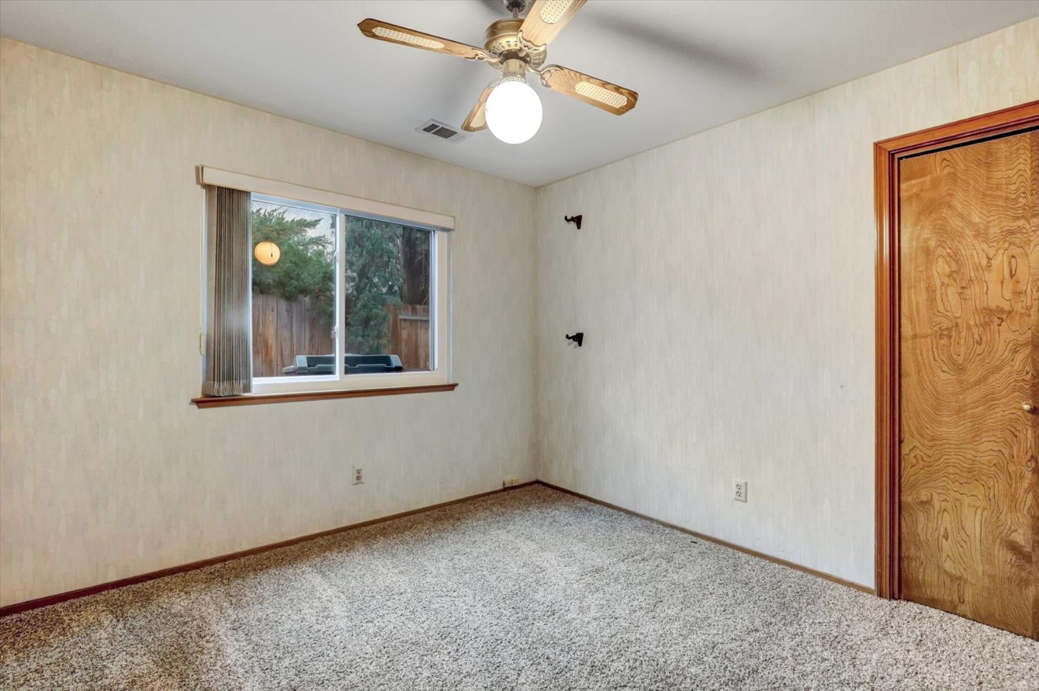 5316 Engle Road Carmichael, CA 95608 - Photo 33 of 47 a view of an empty room with window and chandelier fan