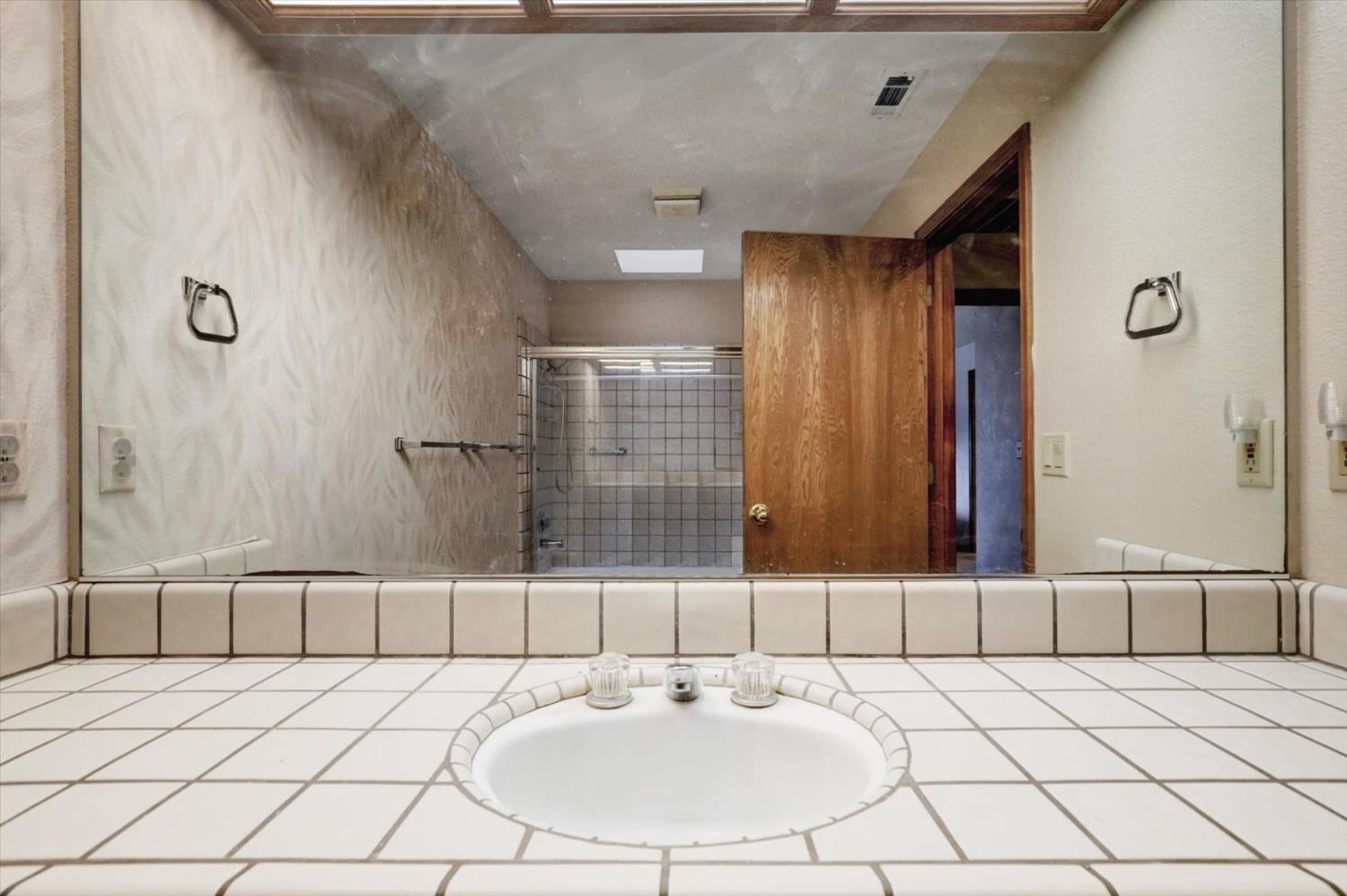 5316 Engle Road Carmichael, CA 95608 - Photo 38 of 47 a bathroom with a sink and a mirror