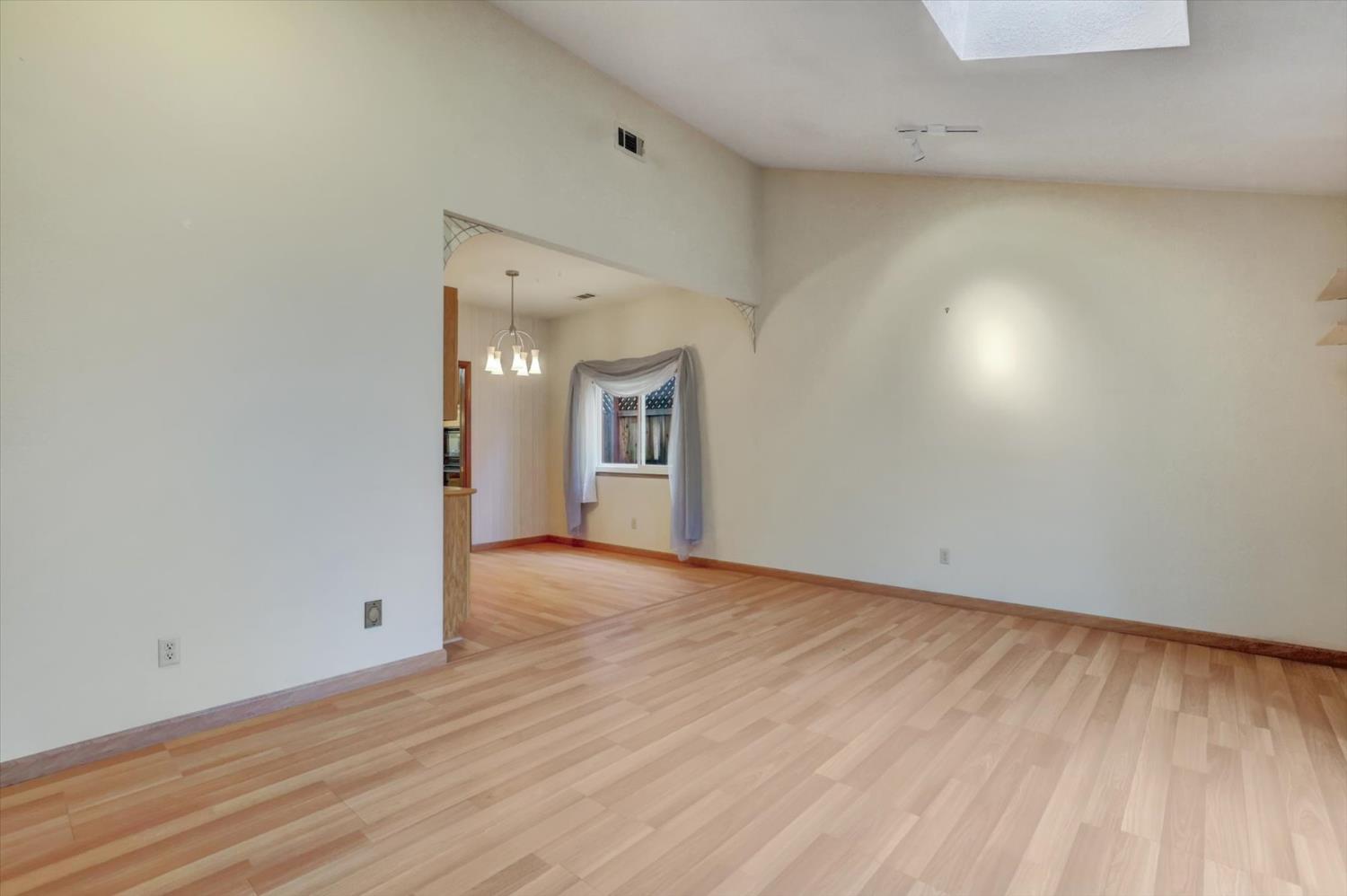 5316 Engle Road Carmichael, CA 95608 - Photo 8 of 47 a view of an empty room with wooden floor and a window