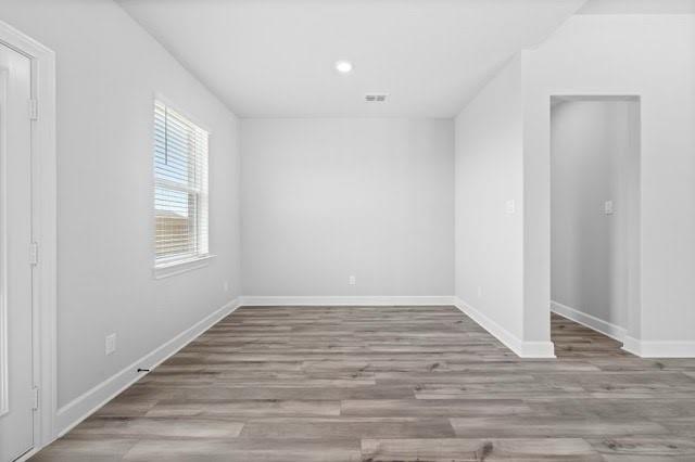 2004 Hardwick Drive Anna, TX 75409 - Photo 9 of 18 a view of an empty room with wooden floor and a window