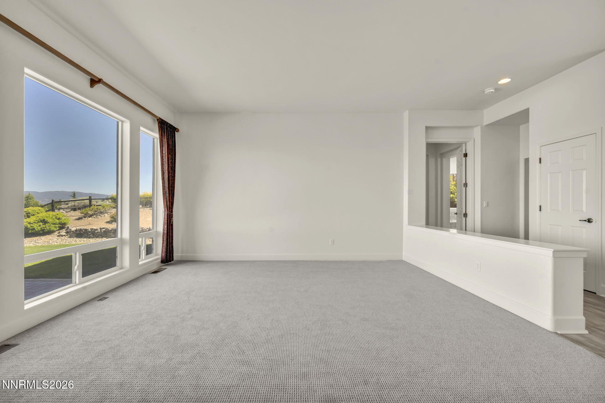 574 Echo Ridge Court Reno, NV 89511 - Photo 19 of 58 a view of an empty room with a window