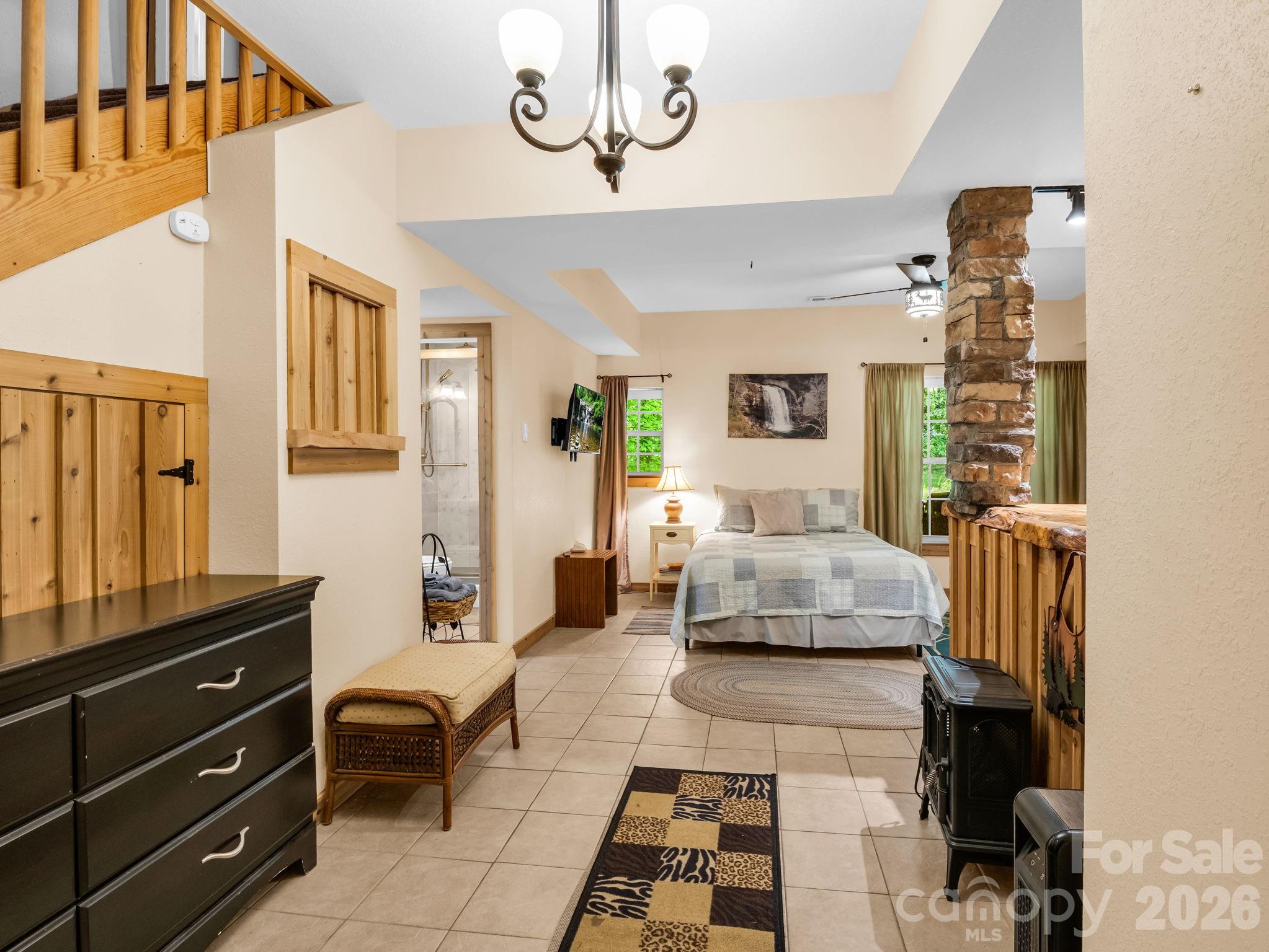 165 Dream Road Hendersonville, NC 28792 - Photo 24 of 46 a bedroom with furniture and a couch