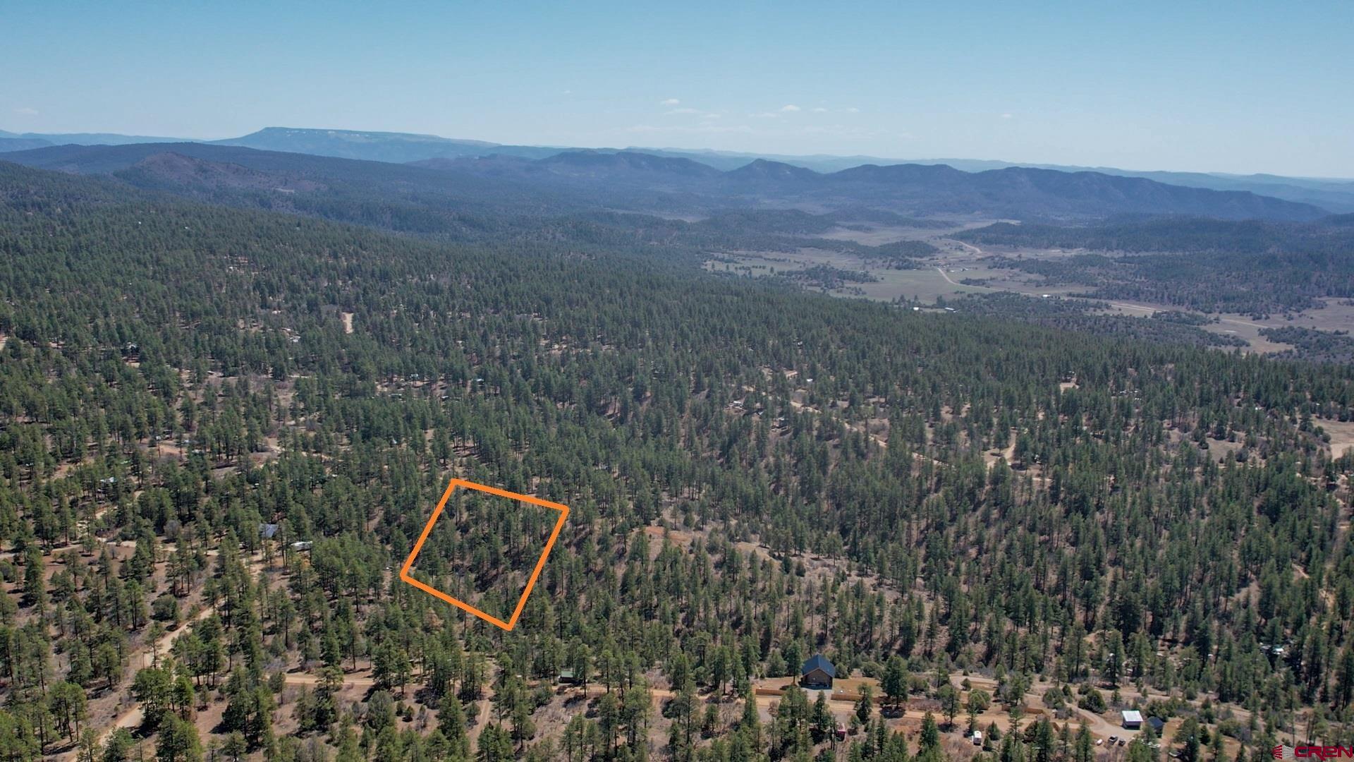 87 Engineer Point Pagosa Springs, CO 81147 - Photo 2 of 13 a view of a lush green hillside and a building