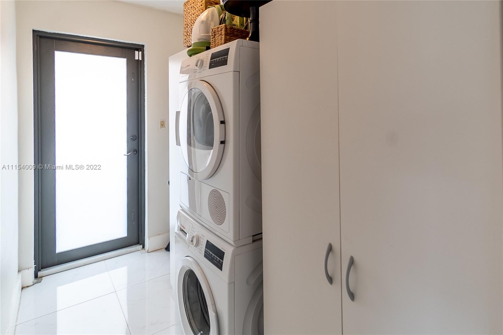 4235 East 9th Lane Hialeah, FL 33013 - Photo 24 of 34 a utility room with dryer and washer