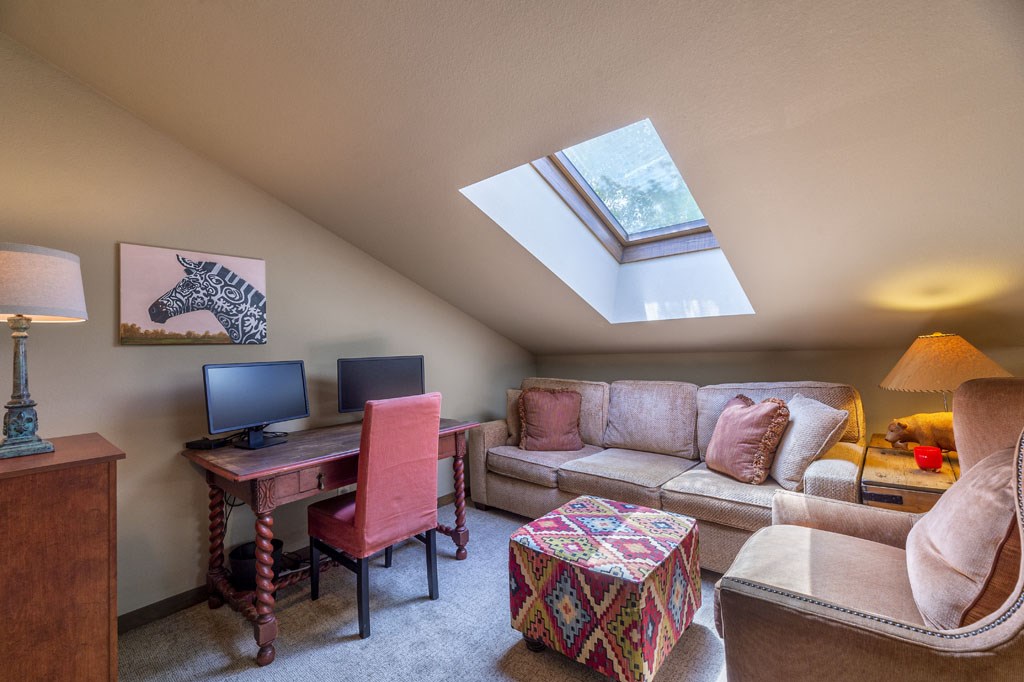 118 Topaz Road Silverthorne, CO 80498 - Photo 23 of 34 Loft area is designed for lounging and a home office. Skylights filter all day sunshine for a bright and productive work area.