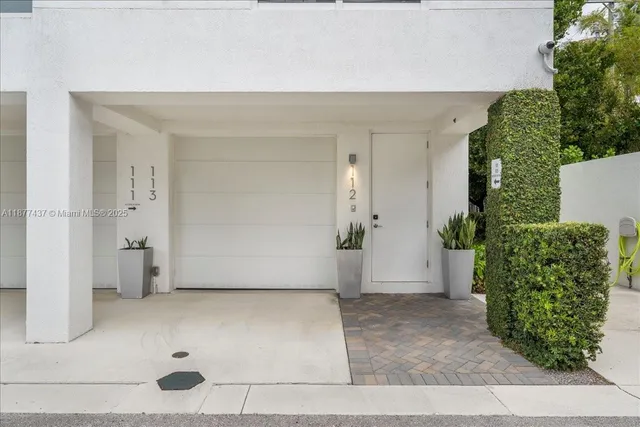an empty room with a potted plant