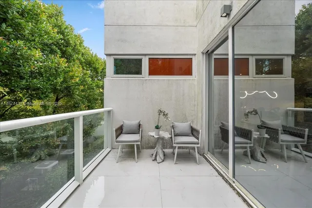 a view of a chairs with a glass door