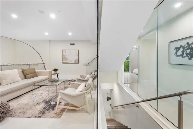 a living room with furniture and a rug