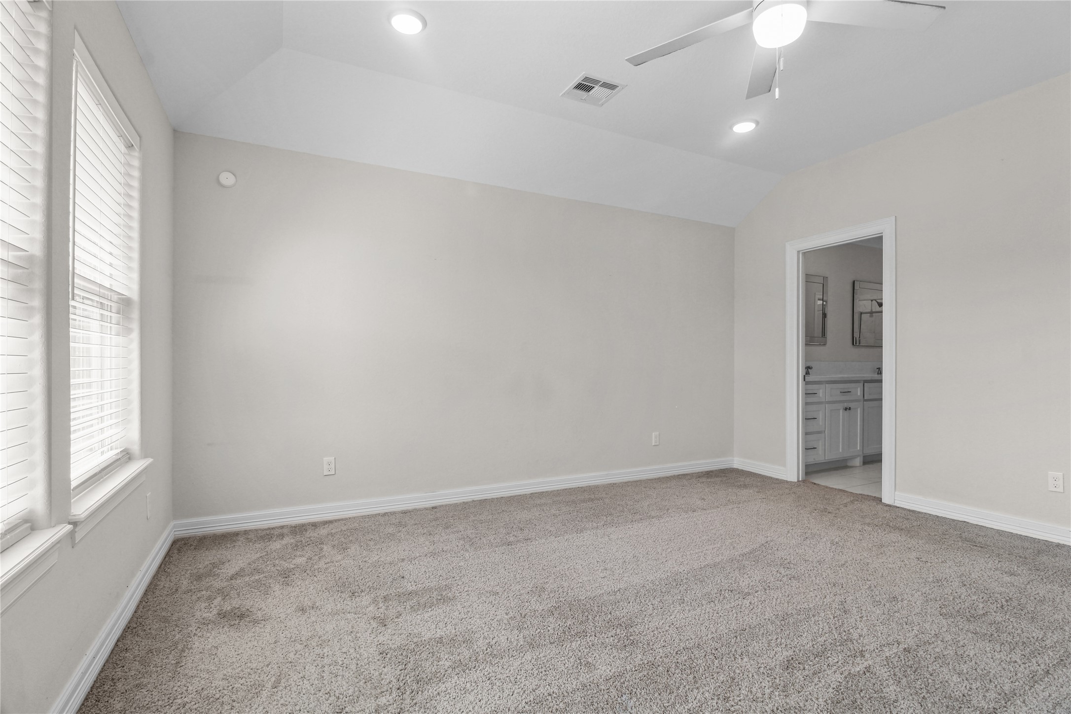 1208 East Henderson Road Angleton, TX 77515 - Photo 11 of 29 an empty room with windows and fan