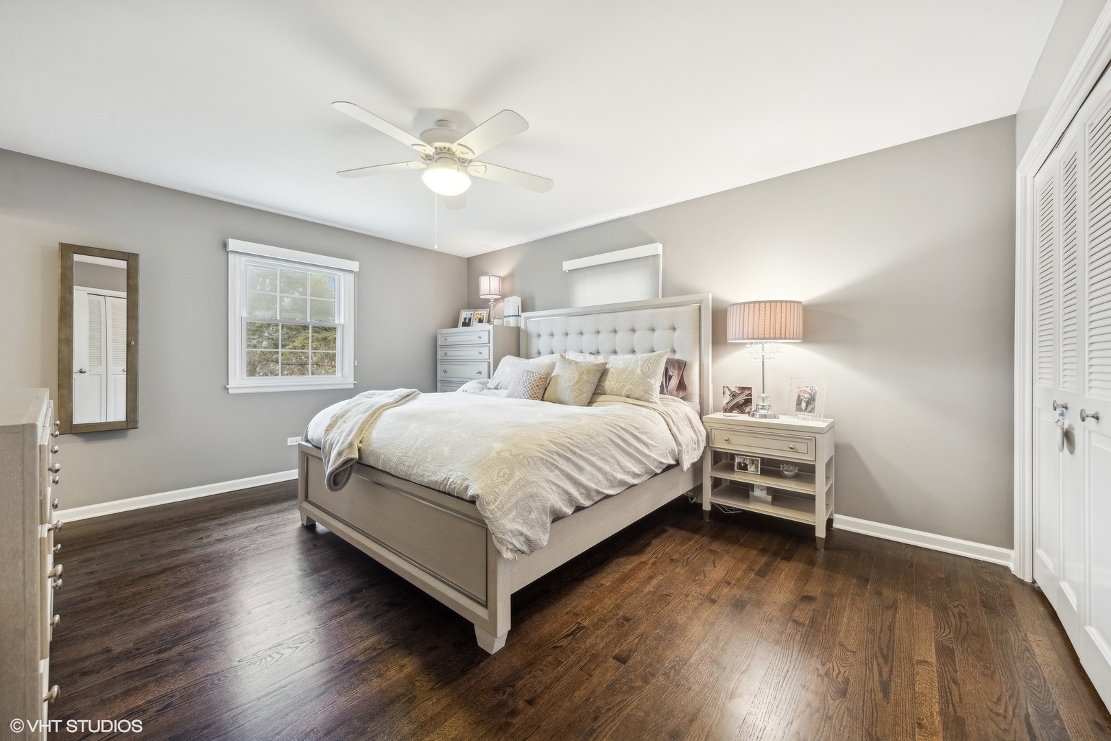 41 Swift Lane Naperville, IL 60565 - Photo 12 of 25 a bedroom with a bed and a chandelier