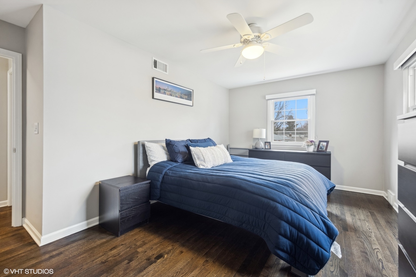 41 Swift Lane Naperville, IL 60565 - Photo 14 of 25 a bedroom with a bed and a chandelier