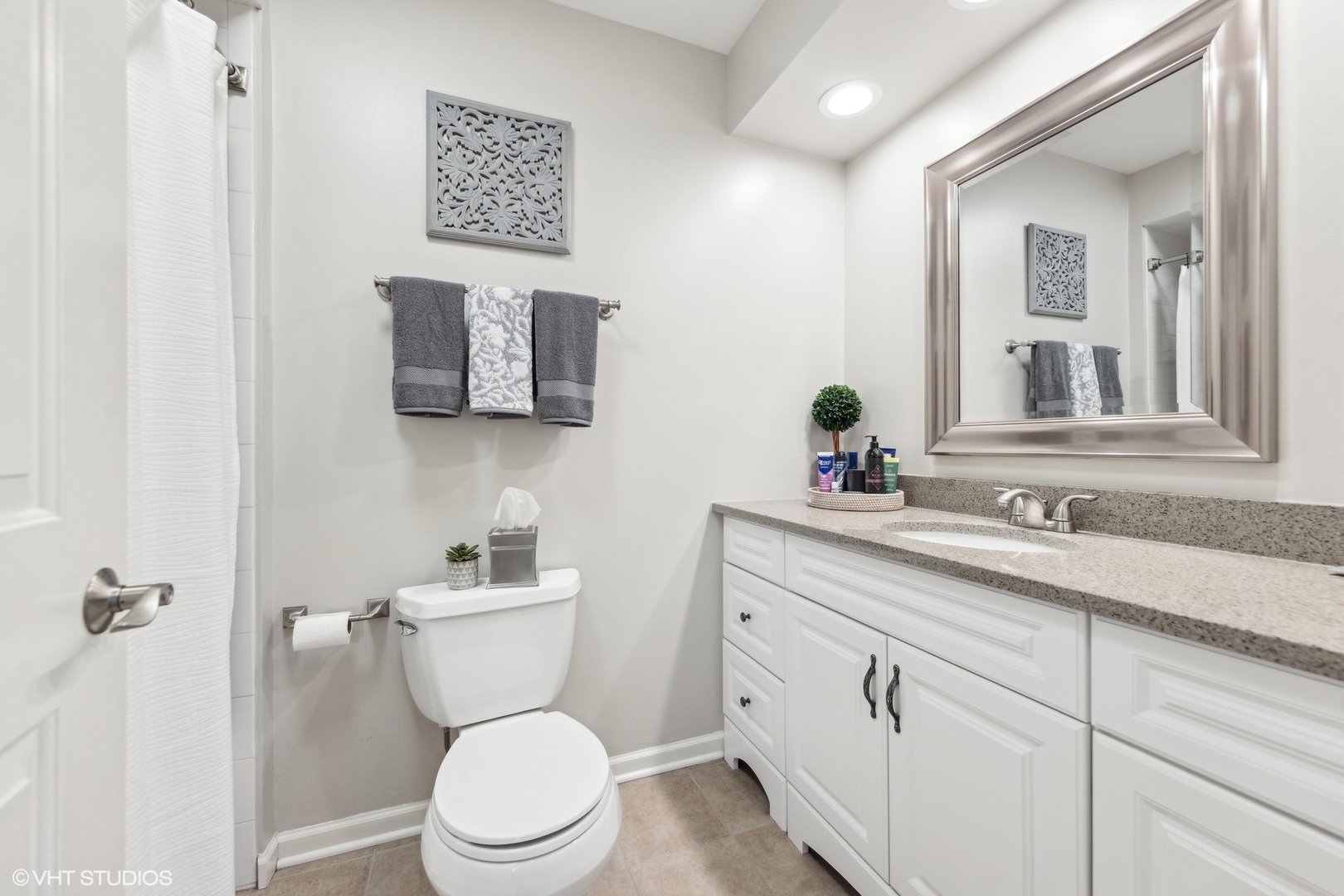 41 Swift Lane Naperville, IL 60565 - Photo 17 of 25 a bathroom with a toilet sink and mirror