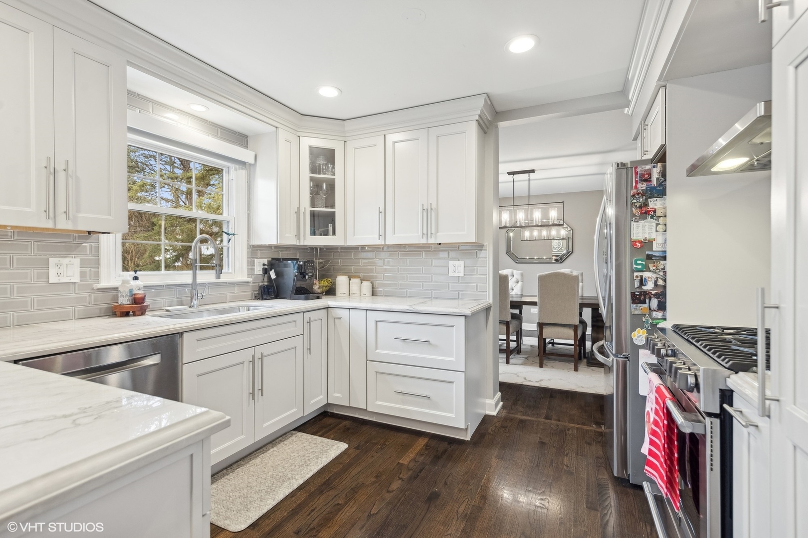41 Swift Lane Naperville, IL 60565 - Photo 6 of 25 a kitchen that has a lot of cabinets in it and wooden floors