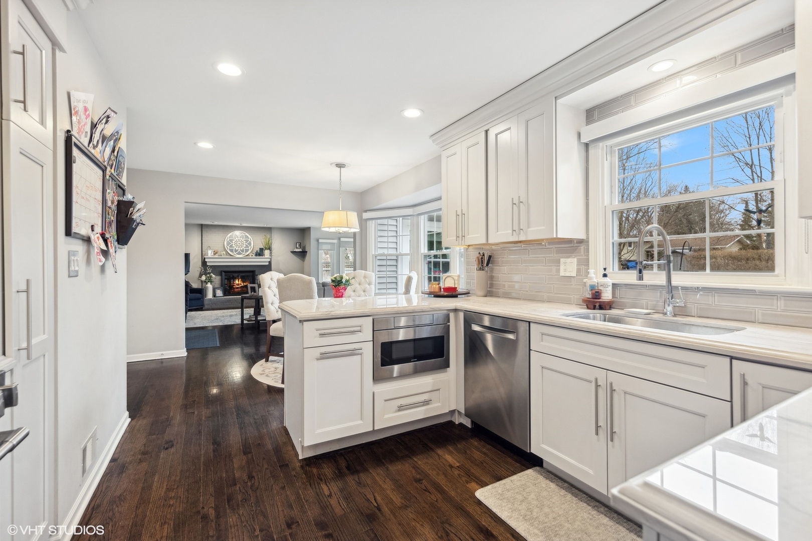 41 Swift Lane Naperville, IL 60565 - Photo 7 of 25 a kitchen with white cabinets and white appliances