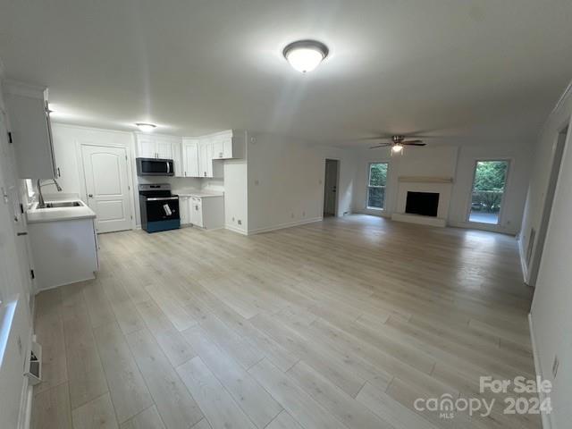 5052 Suwarrow Court Fort Mill, SC 29708 - Photo 3 of 9 a view of a kitchen with a sink cabinets and wooden floor