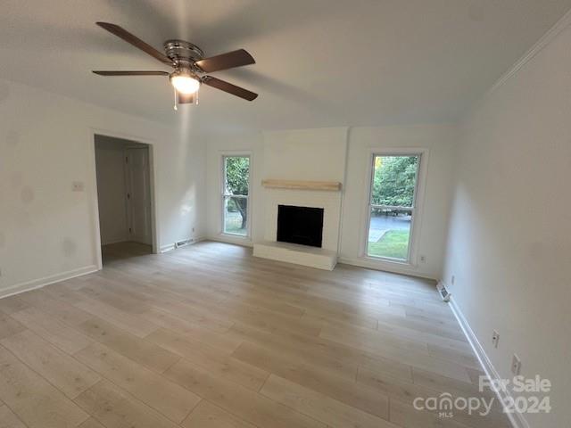 5052 Suwarrow Court Fort Mill, SC 29708 - Photo 4 of 9 an empty room with windows and fireplace