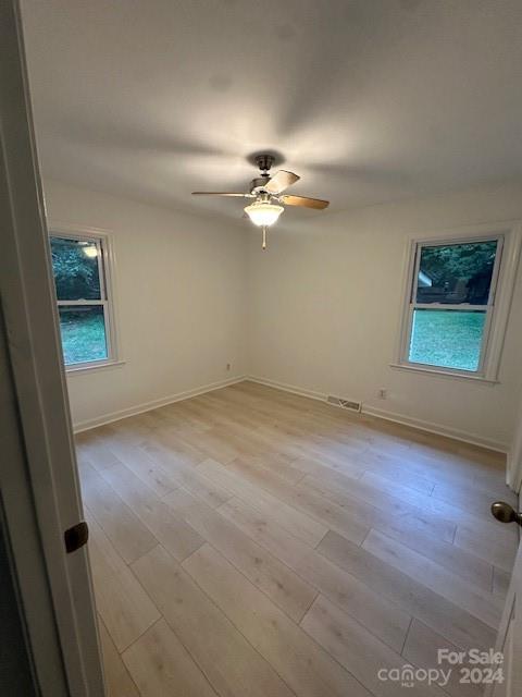 5052 Suwarrow Court Fort Mill, SC 29708 - Photo 6 of 9 an empty room with windows and fan