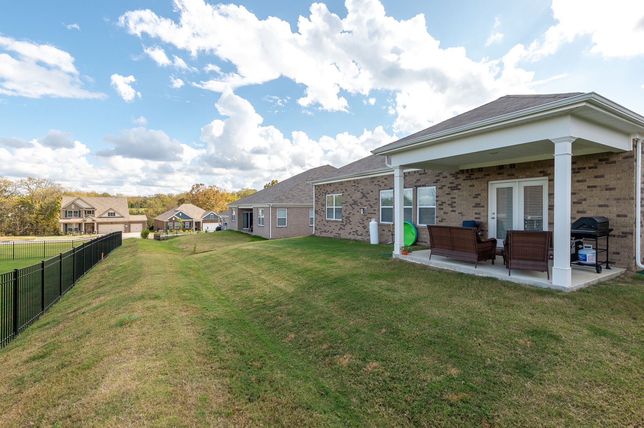 9003 Lockeland Drive Spring Hill, TN 37174 - Photo 16 of 16 a view of a house with backyard porch and garden