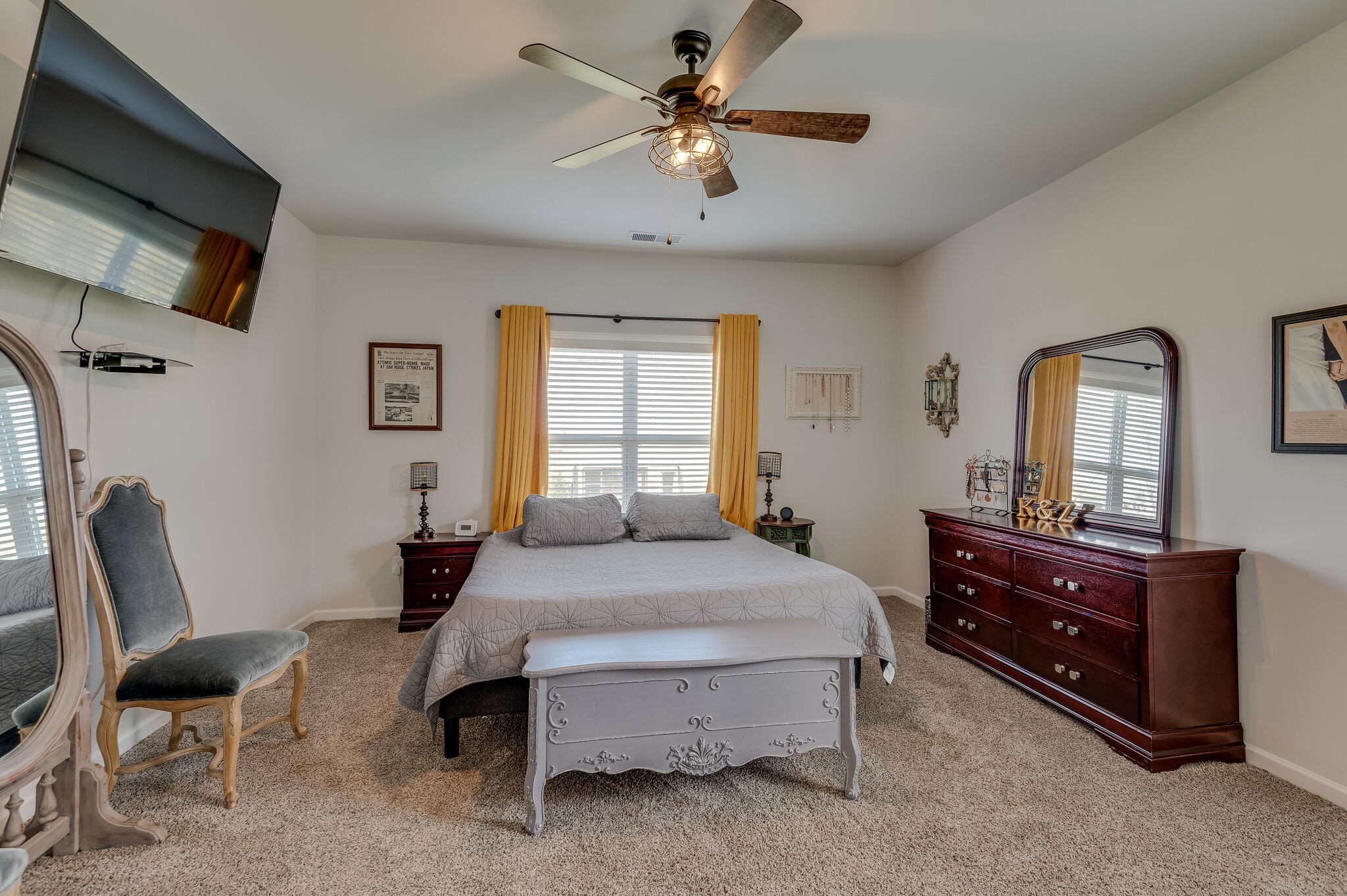 9003 Lockeland Drive Spring Hill, TN 37174 - Photo 7 of 16 a bedroom with a bed a dresser and chair