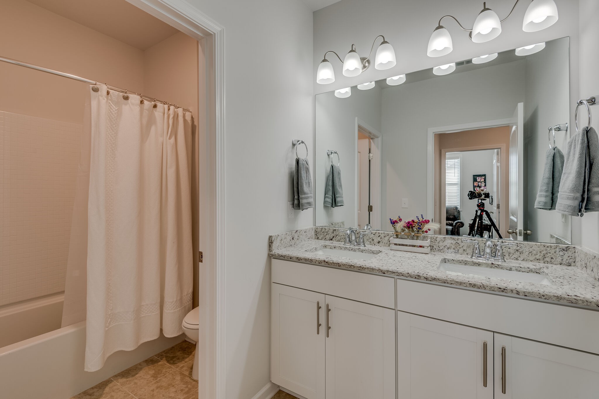 9003 Lockeland Drive Spring Hill, TN 37174 - Photo 10 of 16 a bathroom with a double vanity sink and a mirror