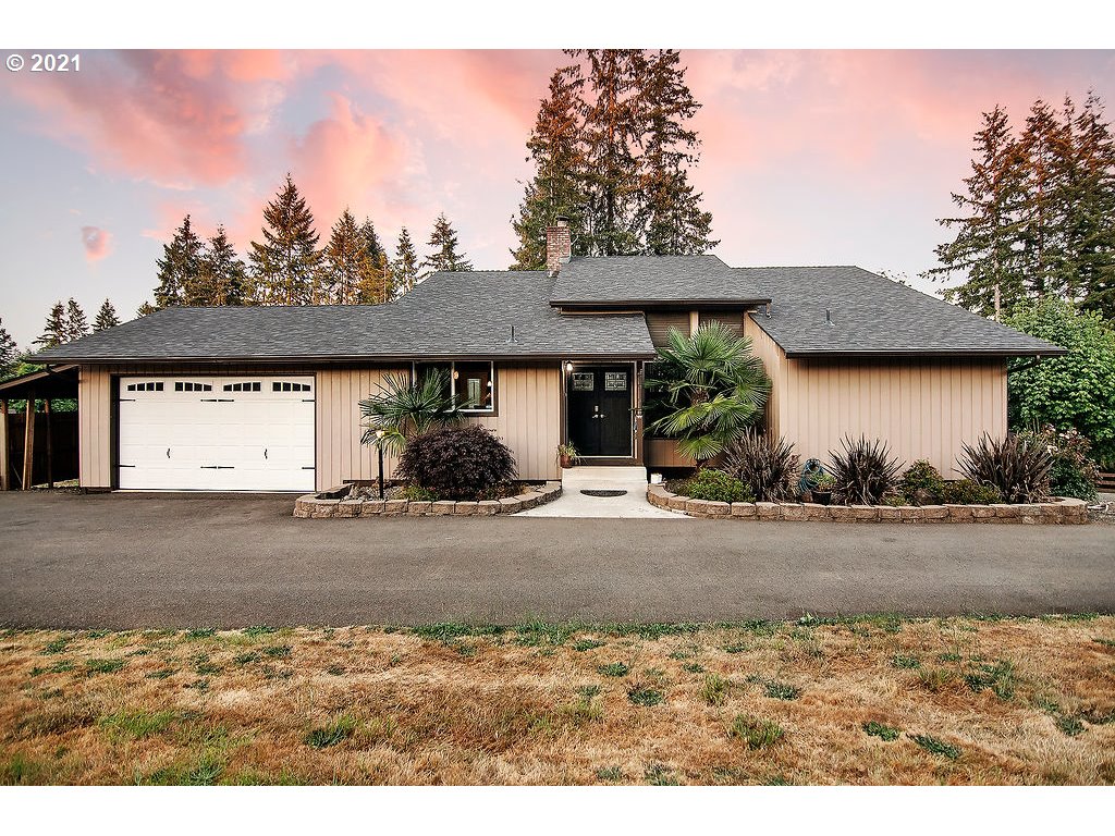 265 Curtis Hill Road Chehalis, WA 98532 - Photo 1 of 32 a view of a house with a yard and floor to ceiling window