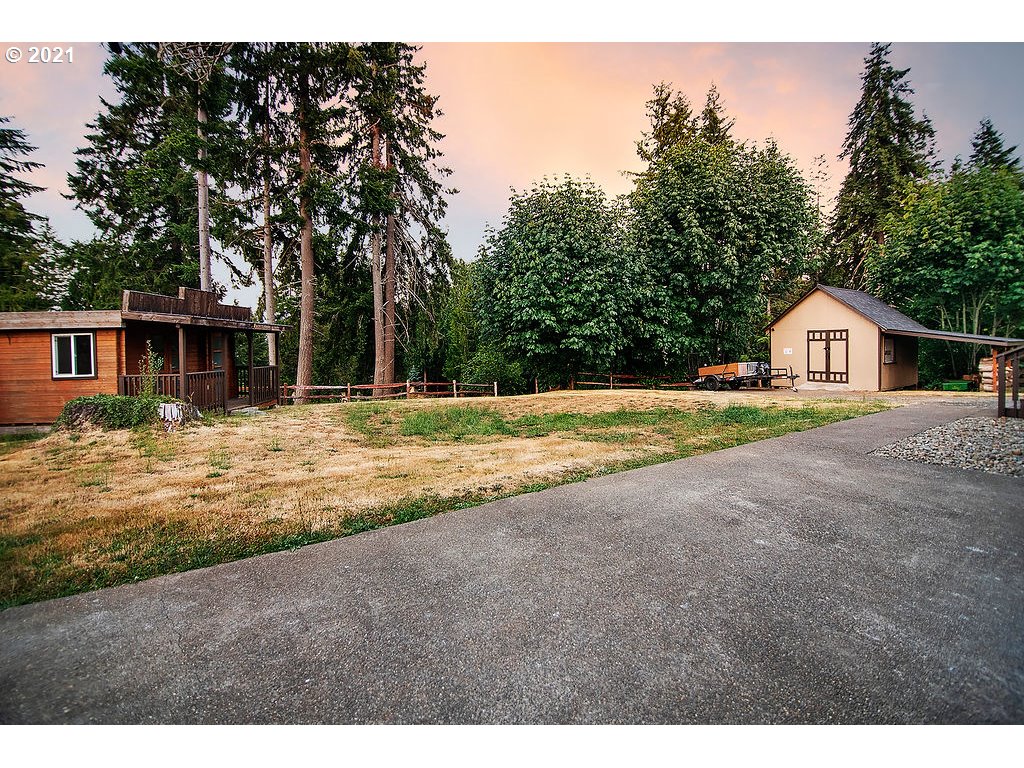 265 Curtis Hill Road Chehalis, WA 98532 - Photo 29 of 32 a view of an house with backyard and trees