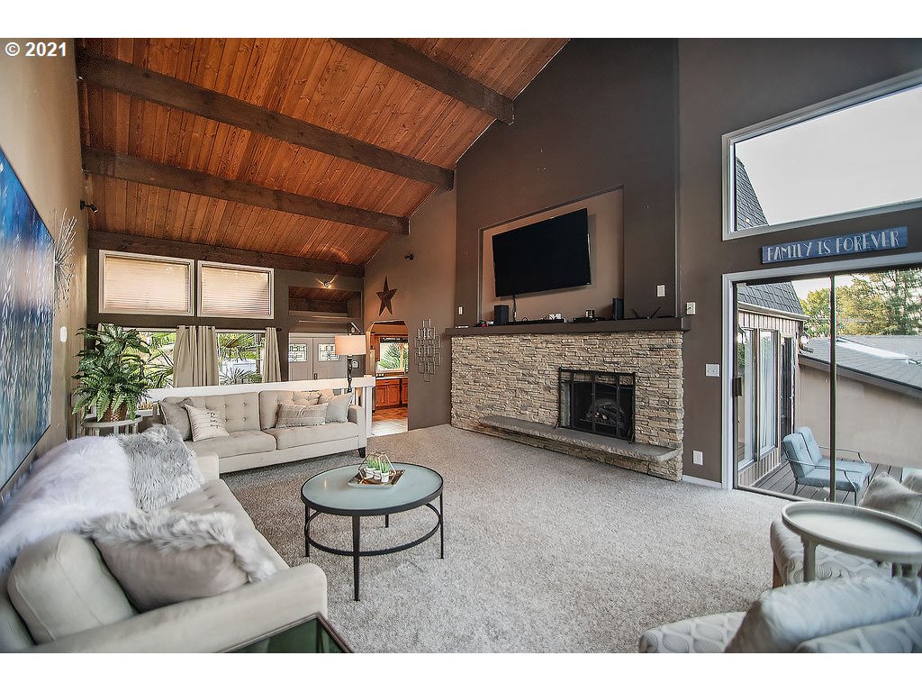 265 Curtis Hill Road Chehalis, WA 98532 - Photo 4 of 32 a living room with furniture a fireplace and a flat screen tv